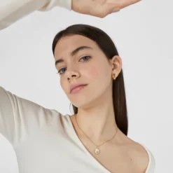 Colgante Leo con baño de oro 18 kt sobre plata, nácar y topacios TOUS Horoscope